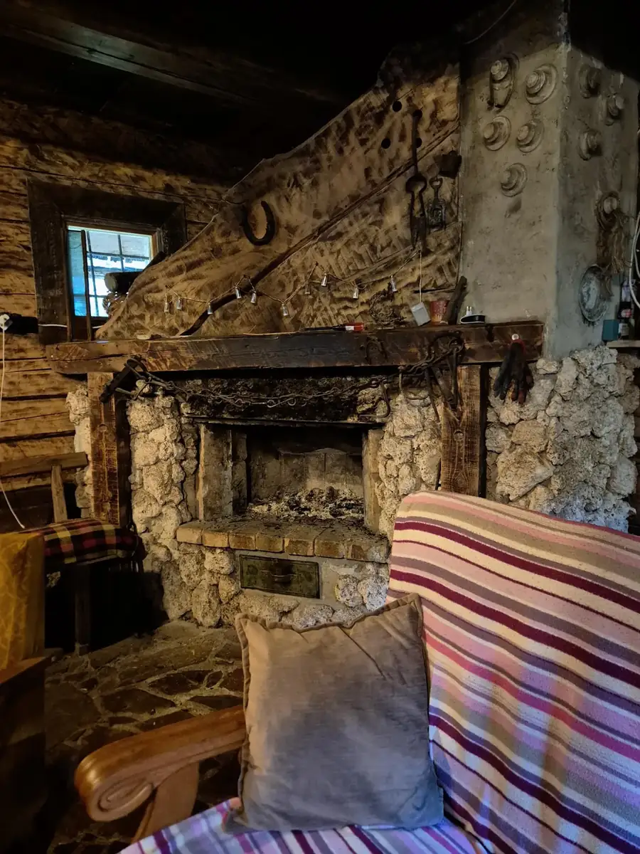 Stone hearth with a striped blanket