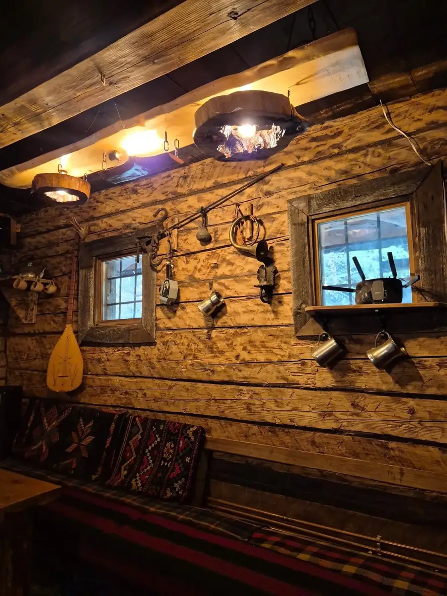 Warm wood interior with a lantern and shelves